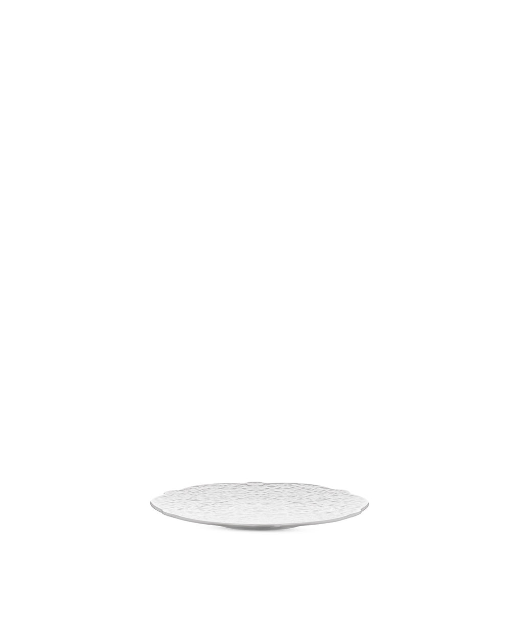 White textured plate by Alessi with an undulating organic pattern, viewed from a slight angle.
