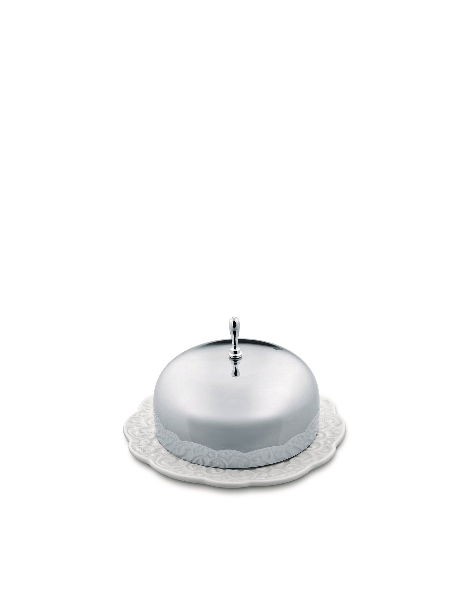 Silver covered butter dish by Alessi with a decorative knob and a white ceramic plate featuring an embossed scrollwork pattern.