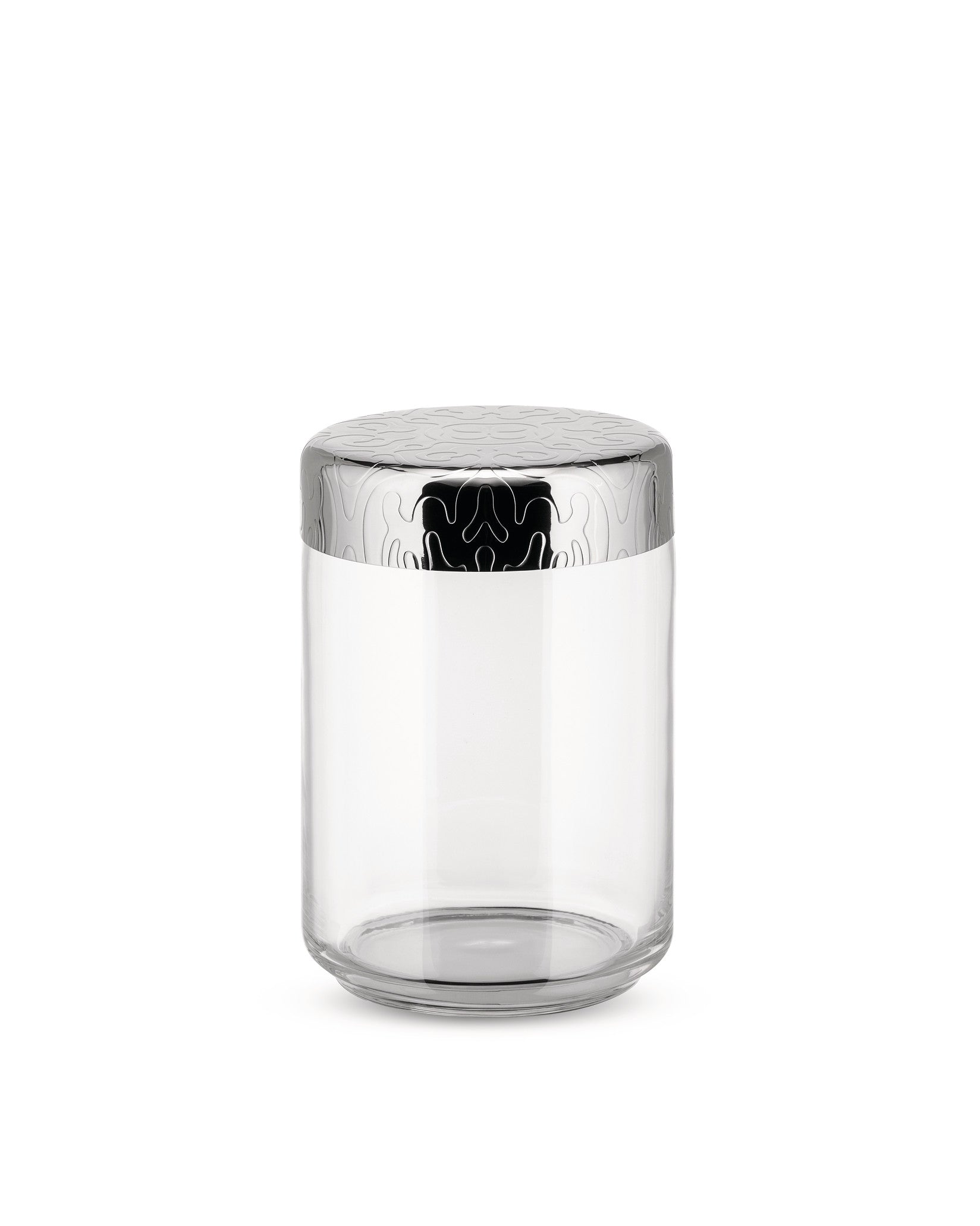 Clear glass storage jar by Alessi with a silver metal lid embossed with a swirling organic pattern.