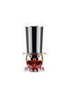 Colorful polished metal clown egg cup by Alessi, with a striped top hat and geometric base.