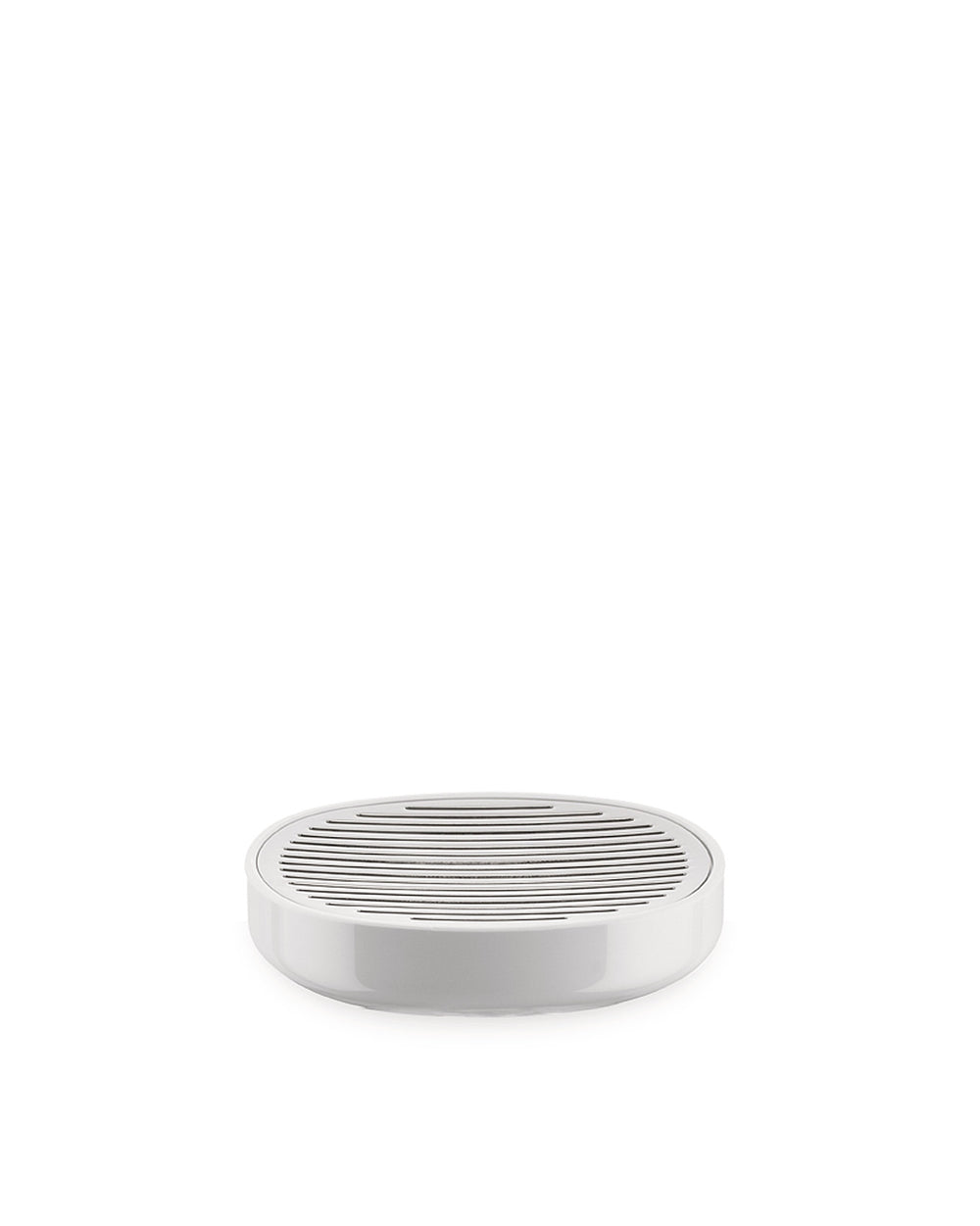 White oval soap dish by Alessi with a slatted draining top, shot from a slightly elevated front view.