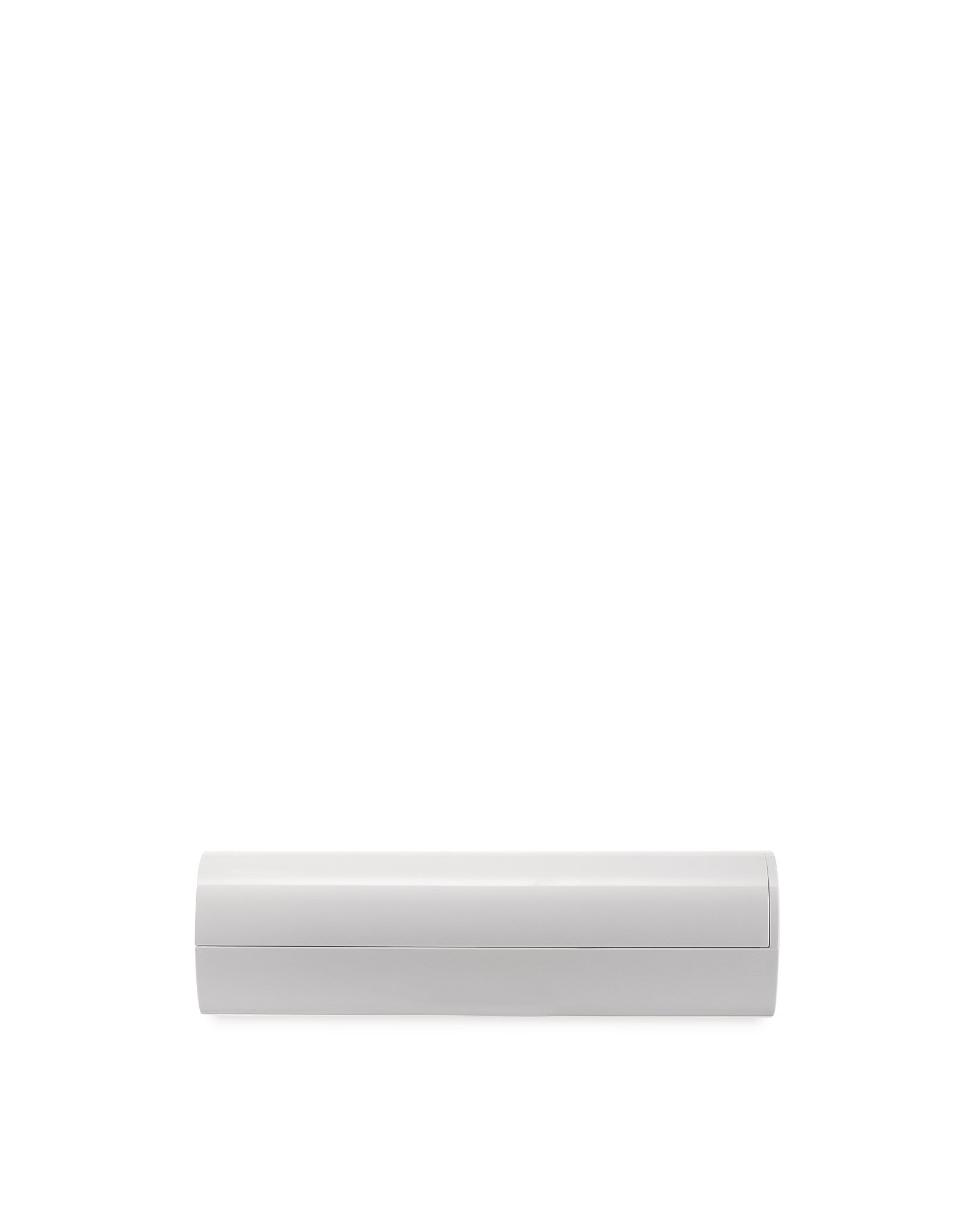 White Birillo container by Alessi, a sleek, minimalist design with a horizontal seam.
