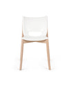 White and natural wood chair by Alessi, front view, with a distinctive oval cutout on the backrest.