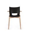 Sleek black and wood chair by Alessi with an oval cutout in the backrest.