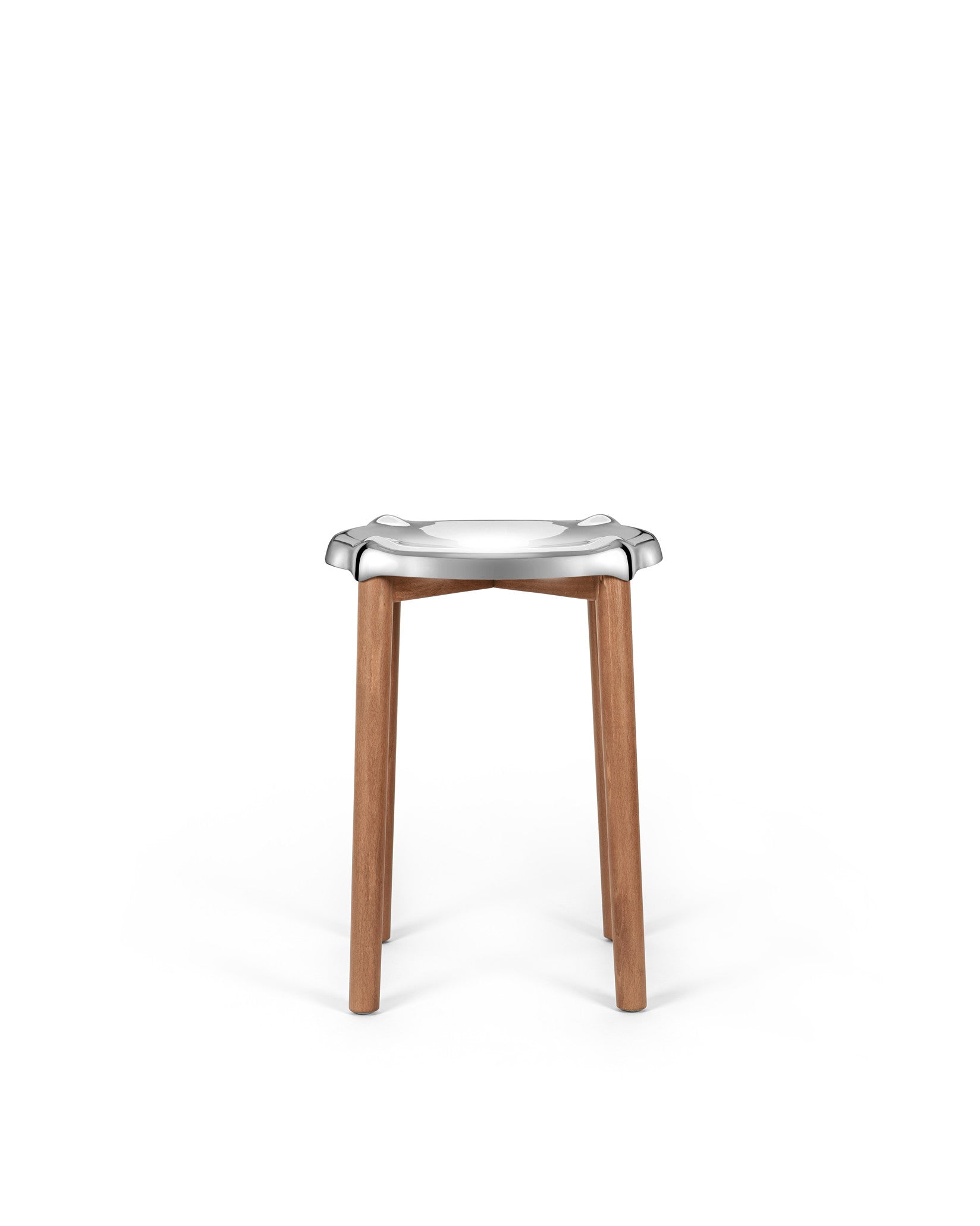 Modern stool with silver metal seat and wooden legs by Alessi, featuring a distinctive organic shape.