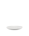 White, shallow oval plate by Alessi with a glossy finish, viewed from a low angle.