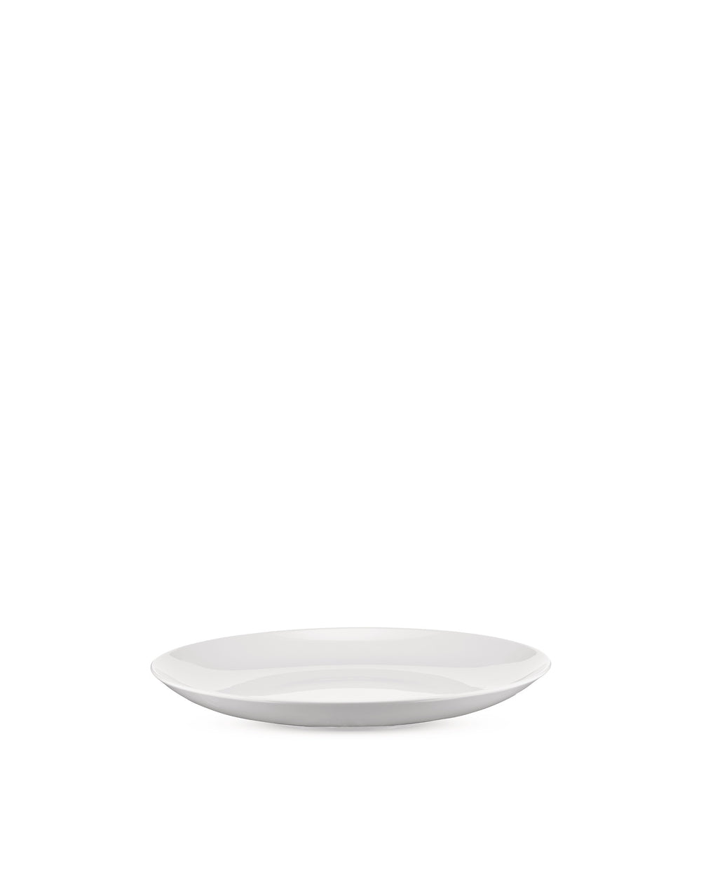 White, shallow oval plate by Alessi with a glossy finish, viewed from a low angle.