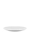 White round plate by Alessi with a smooth surface and subtly curved rim, shown from a low angle.
