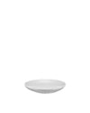 White ceramic saucer by Alessi, simple and elegant, viewed slightly from the front.