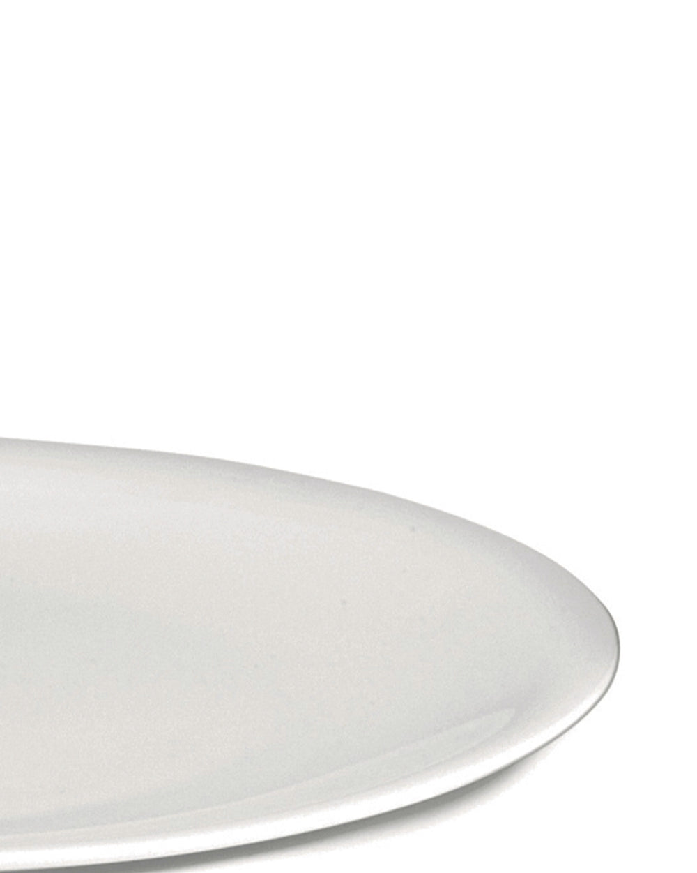 White plate by Alessi with a smooth, minimalist design, shown cropped from the bottom right.