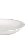 White plate by Alessi, shallow with a wide, smooth rim, shown cropped.
