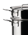 Stainless steel steamer pot by Alessi with two levels, polished finish, and ergonomic handles, close-up view.