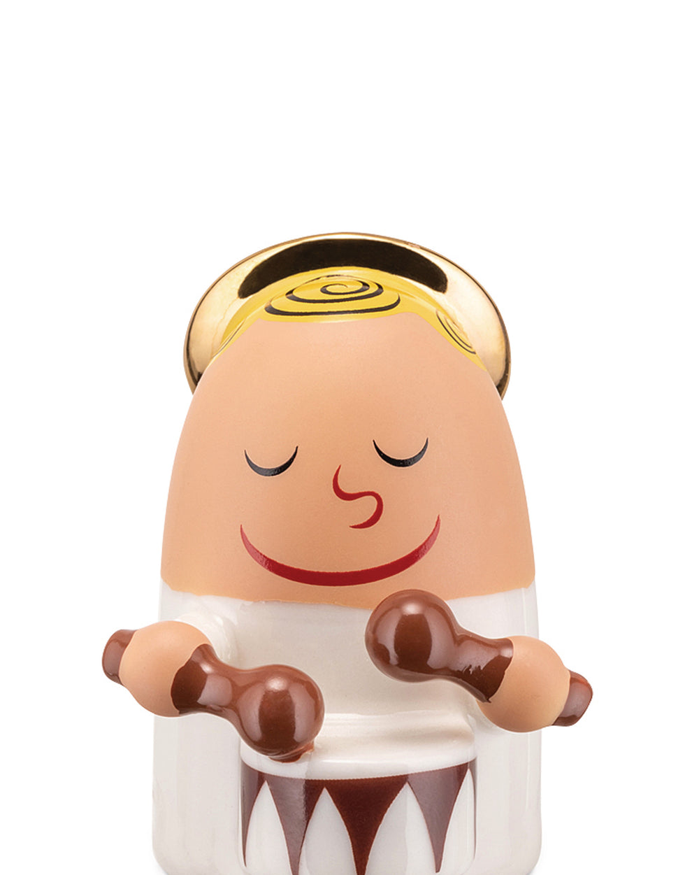 Light-toned angel figurine by Alessi with a golden spiral halo, closed eyes, smiling, playing a brown and white drum with mallets.