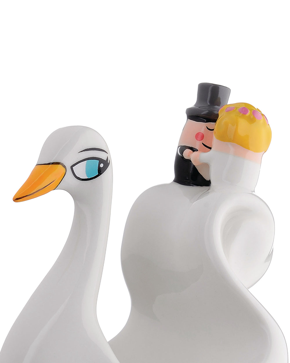 White ceramic wedding cake topper by Alessi, featuring a swan and a cartoon-style bride and groom hugging.