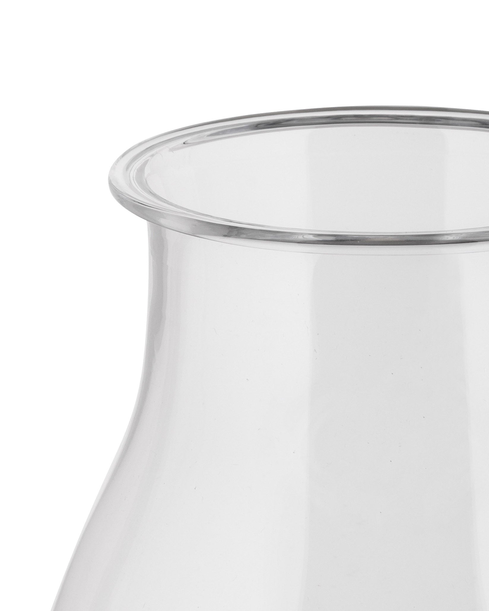 Clear glass Tonale pitcher by Alessi, showing a close-up of its subtly curved rim.