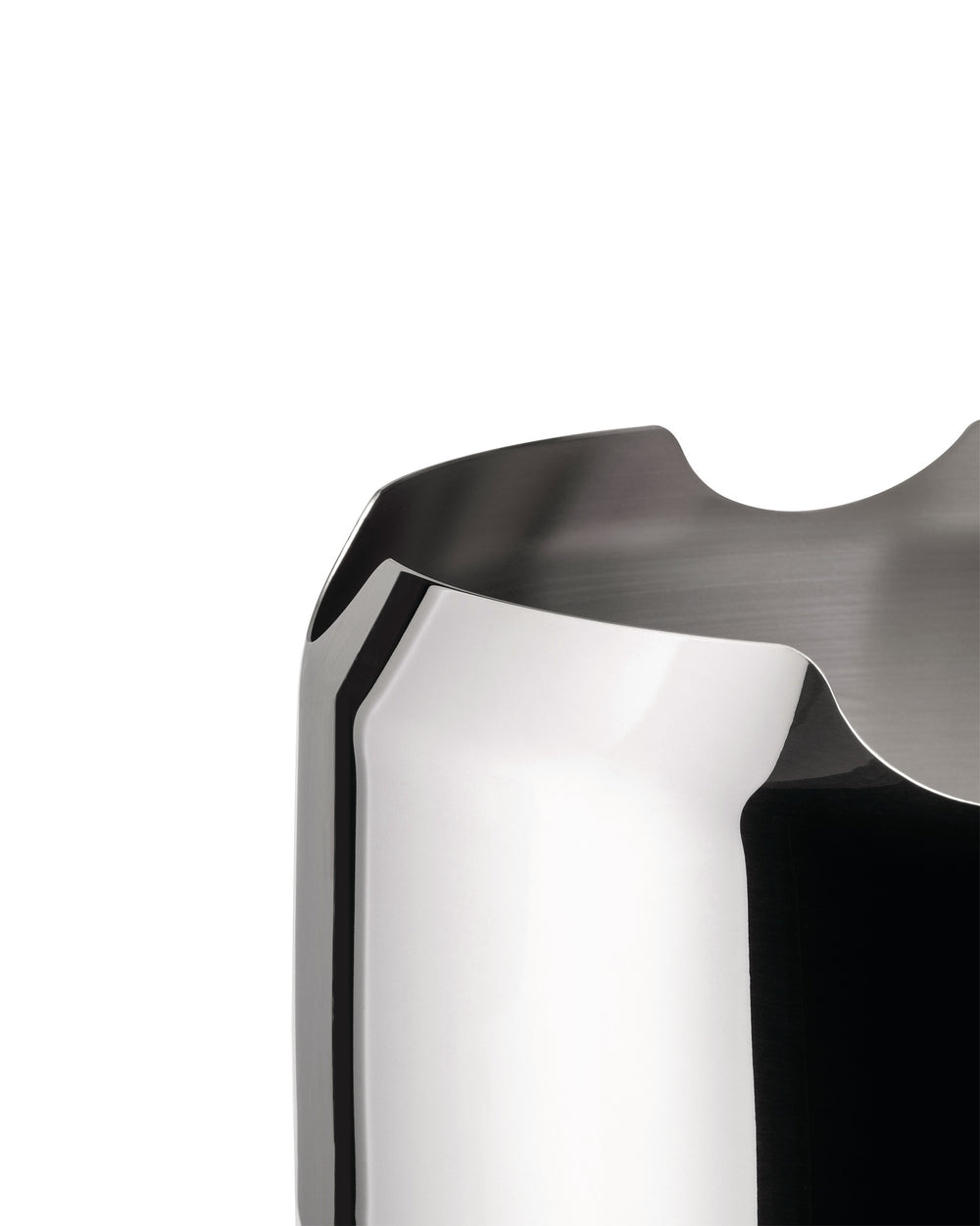 Polished steel bottle holder by Alessi, featuring a wavy, sculpted rim and a brushed interior, in a cropped view.