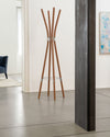 Light brown wooden coat stand with chrome rings by Alessi, featuring curved, radiating poles.