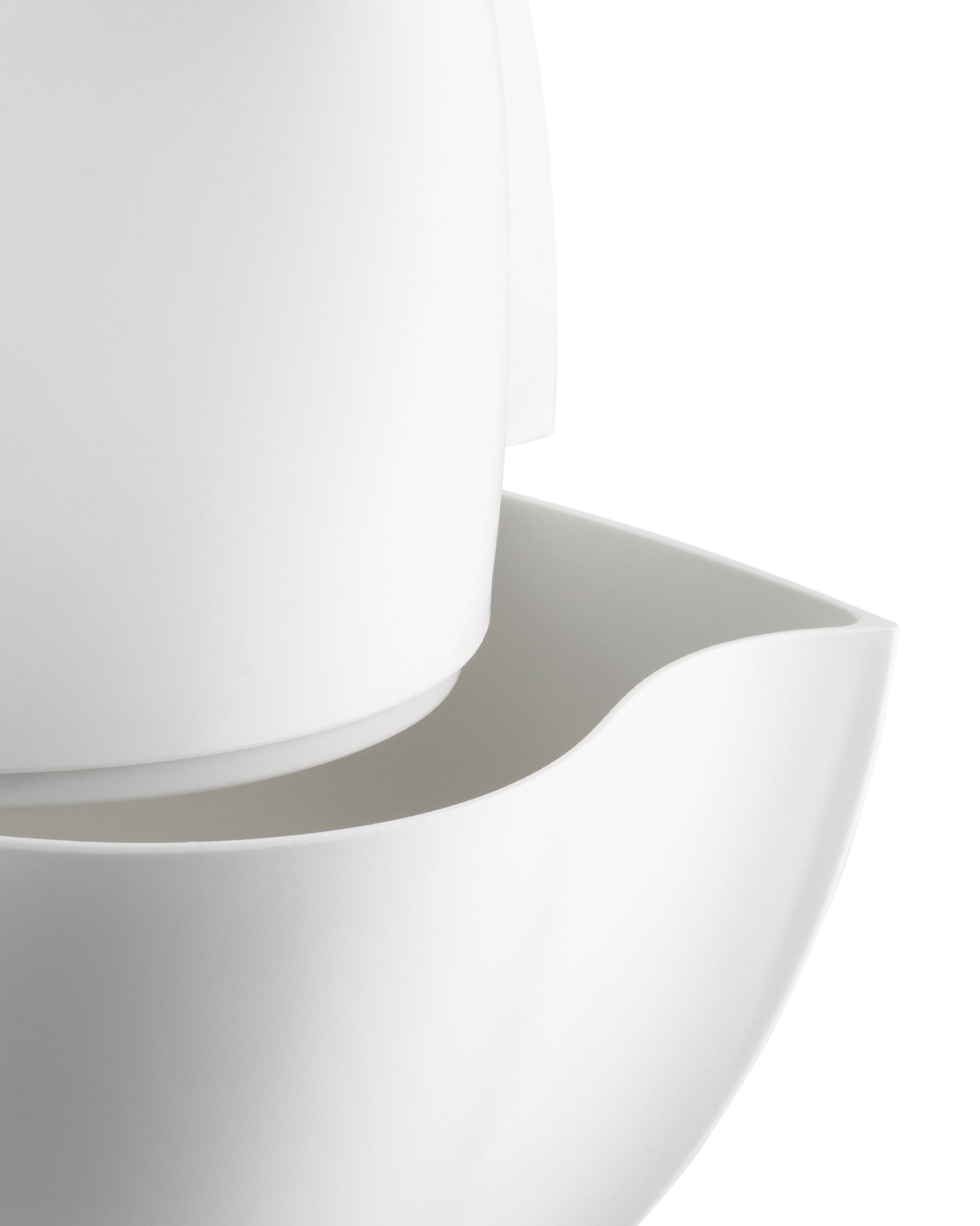 White, smooth, minimalist pitcher by Alessi, featuring a curved spout and stacked components.