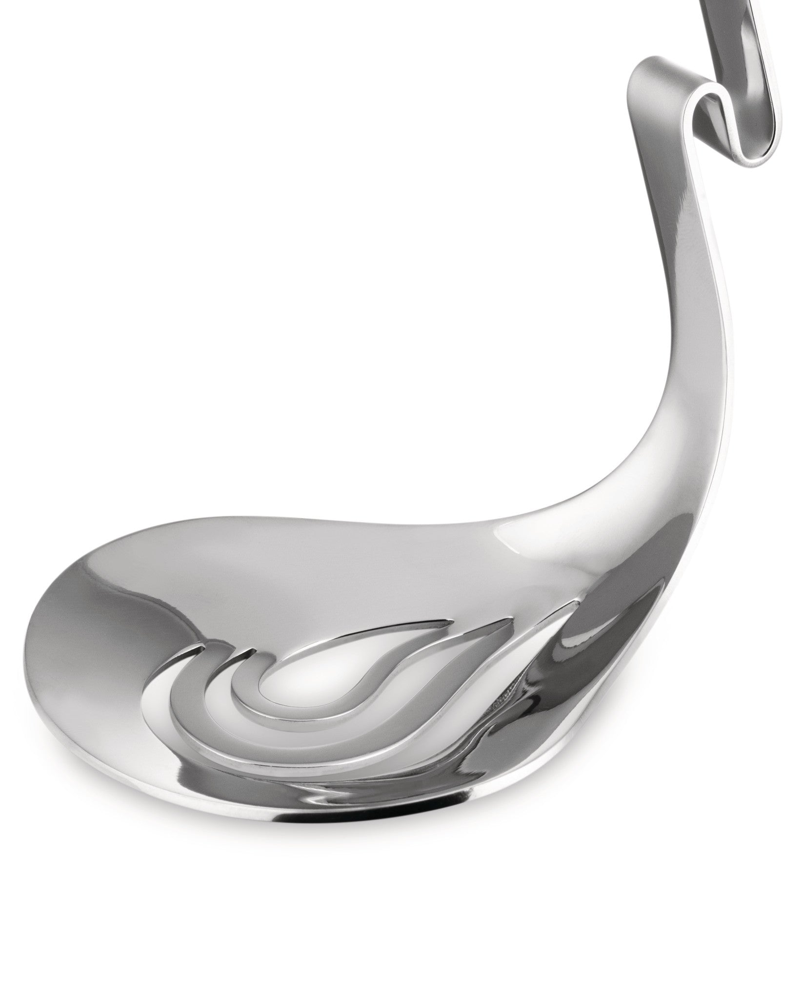 Silver metal serving spoon by Alessi, featuring a sculptural handle acting as a stand and wave-like cutouts in its polished bowl.