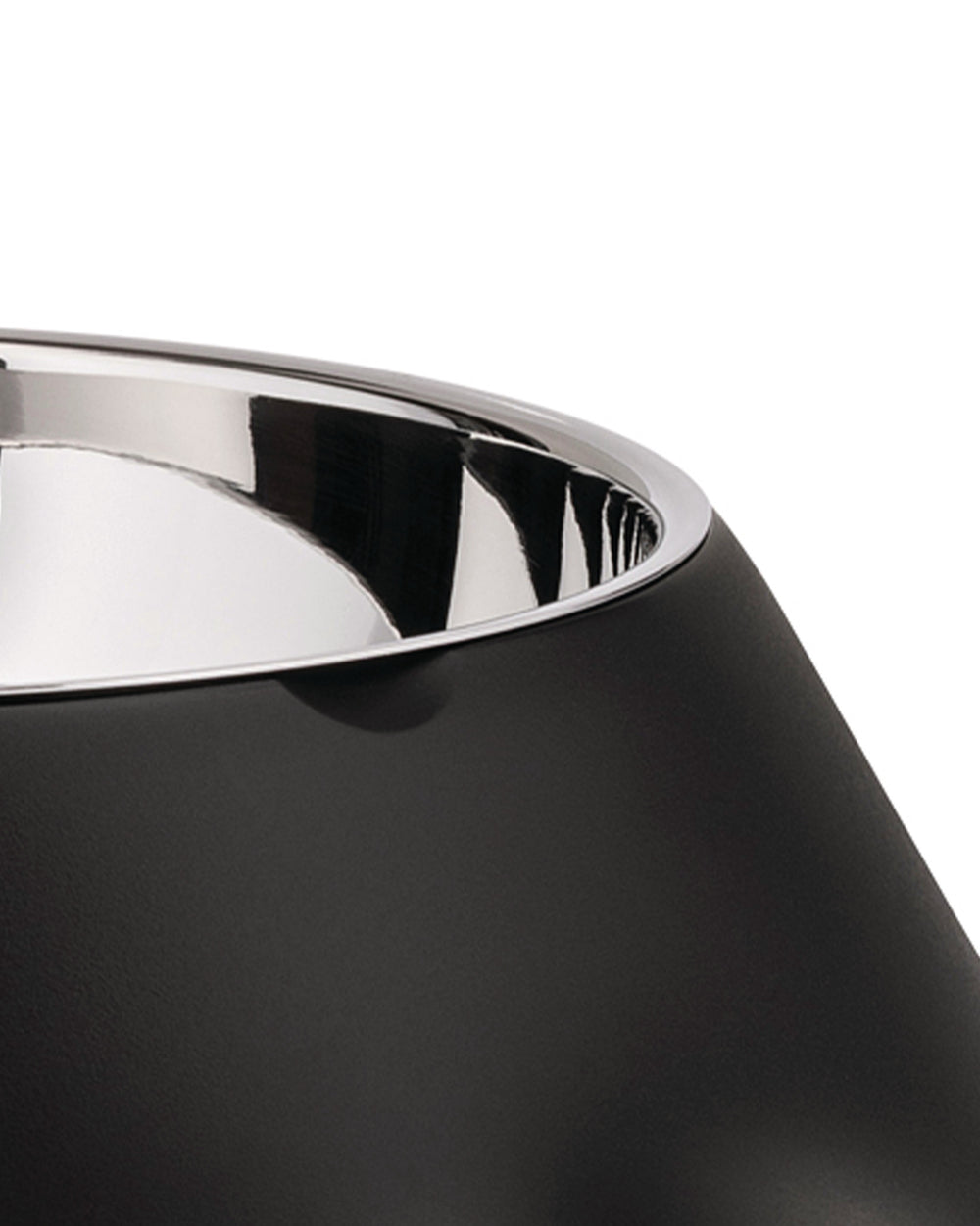 Black matte finish bowl by Alessi with a polished silver rim and a reflective interior, in a cropped view.