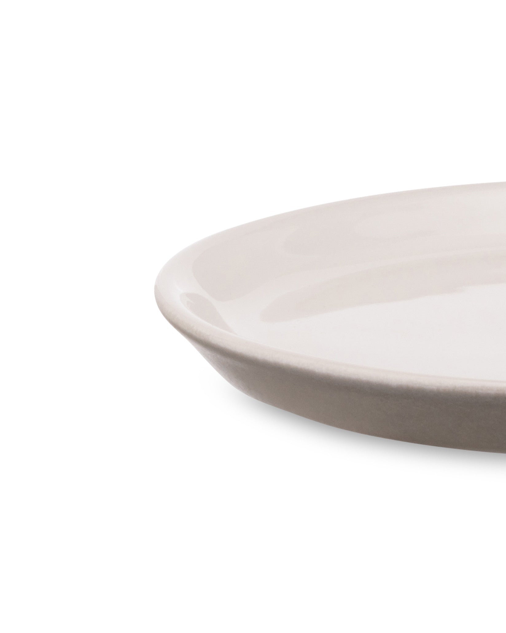 Light beige plate by Alessi, with a subtle taupe rim and glossy interior, shown cropped.