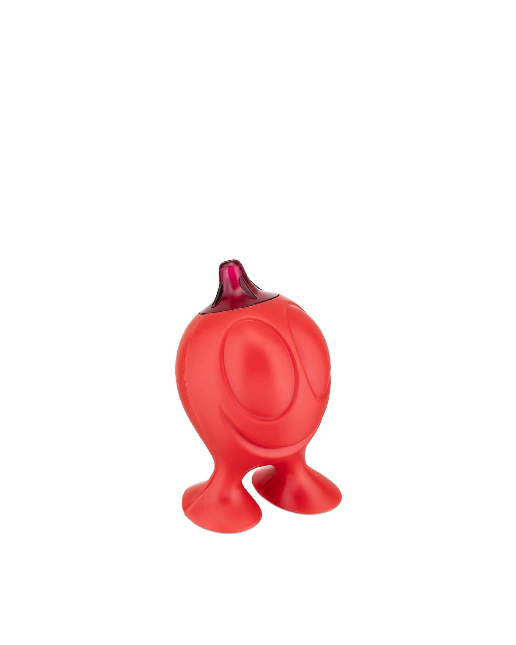 Red Gino Zucchino sugar dispenser by Alessi, a whimsical character with two small feet and a fuchsia top.