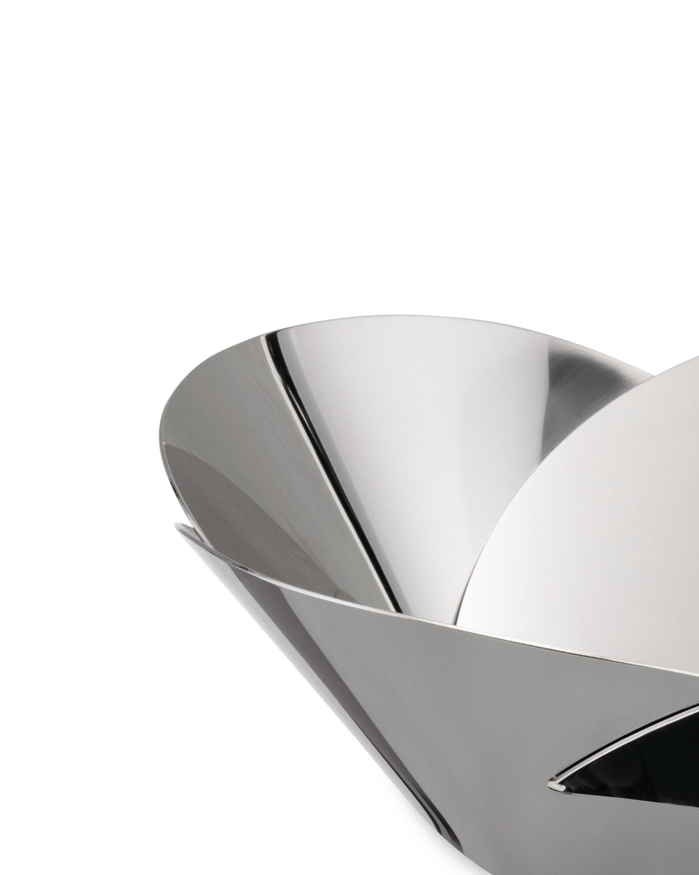 Shiny silver metallic basket by Alessi with a modern, sculptural design of overlapping, curved panels.
