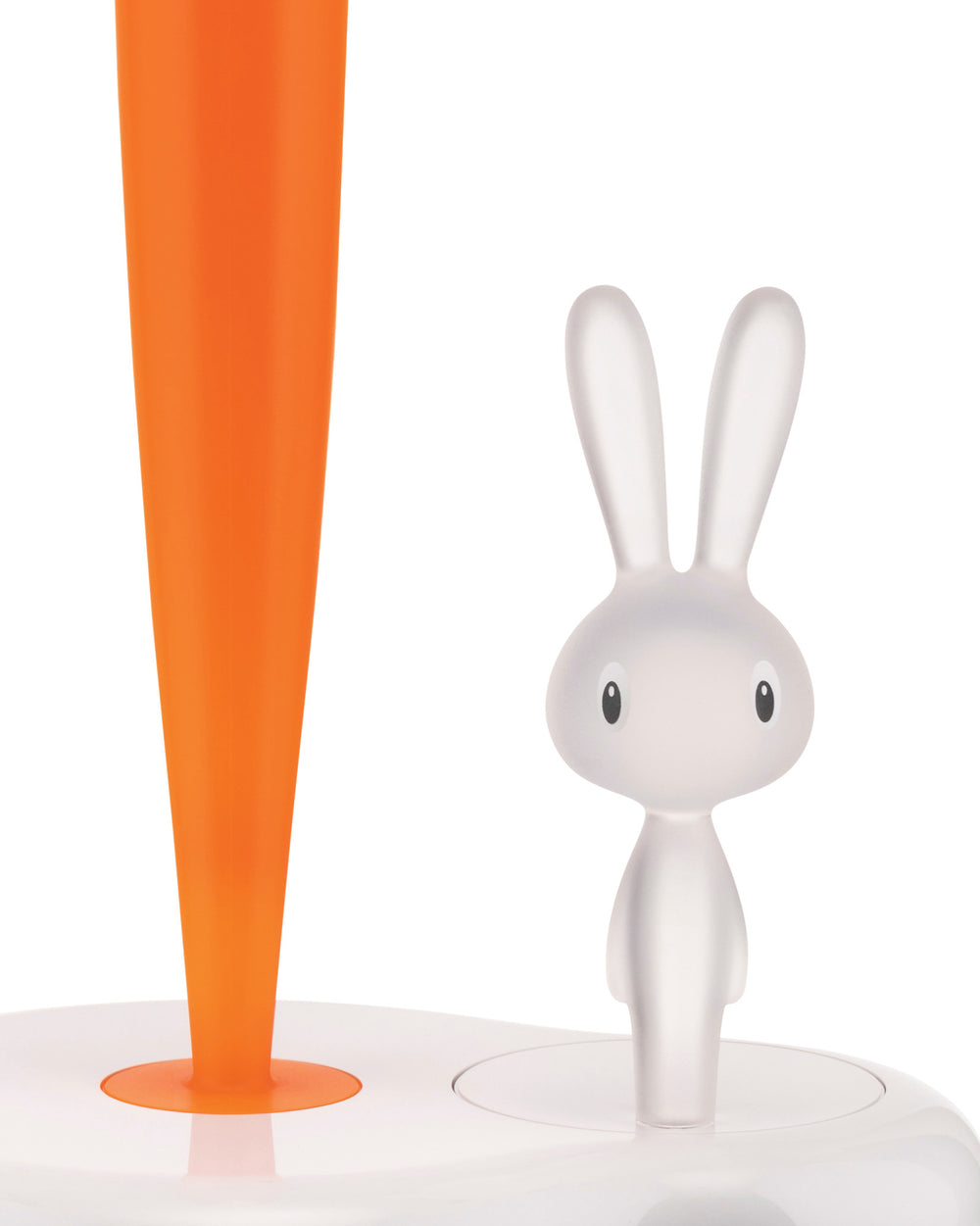 Bright orange carrot and frosted white bunny figurine by Alessi, both standing on a white base.