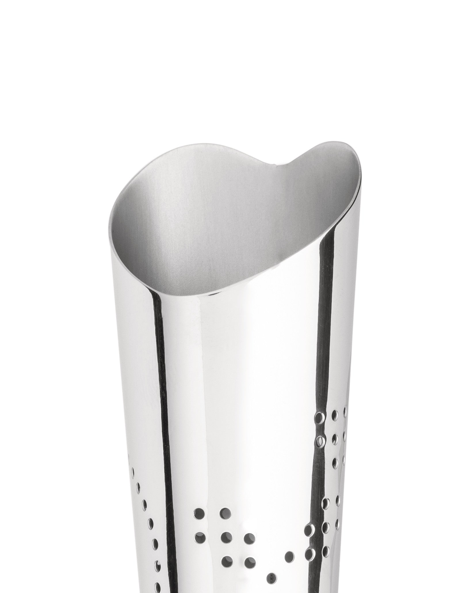 Silver perforated stainless steel object by Alessi with a wavy top edge and a shiny, reflective surface.
