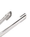 Polished stainless steel ice tongs by Alessi with a distinct curved shape and serrated gripping edges.