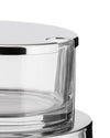 Chrome and glass cheese cellar by Alessi with a shiny reflective lid and clear container, cropped view.