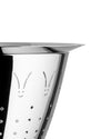 Silver metal colander by Alessi featuring bunny face cut-outs and circular perforations, angled close-up.