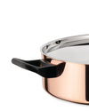 Copper cooking pot by Alessi with a black handle and shiny stainless steel lid, cropped side view.