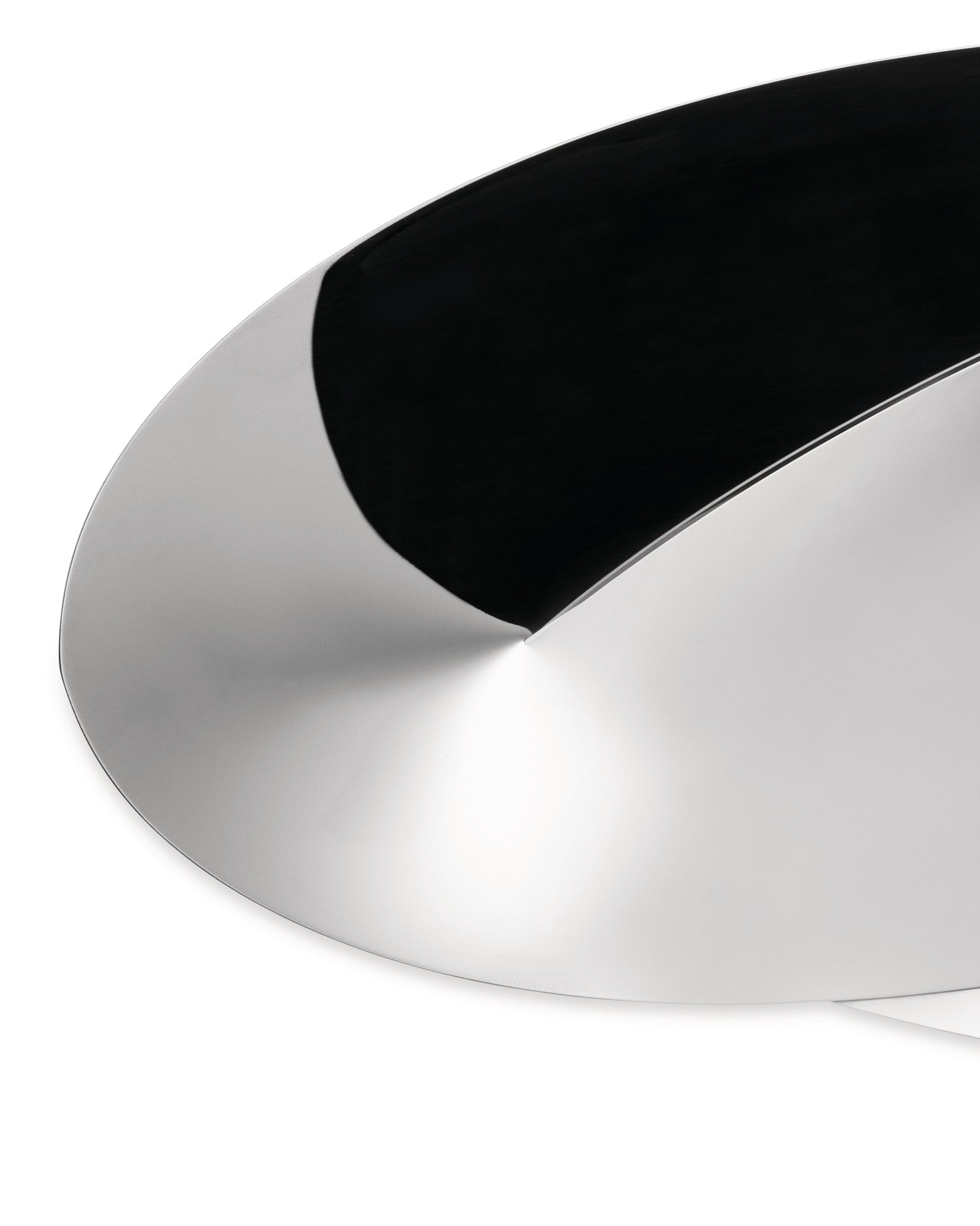 Silver metallic basket by Alessi, with a polished finish and a contrasting dark black interior, in a modern, curved design.