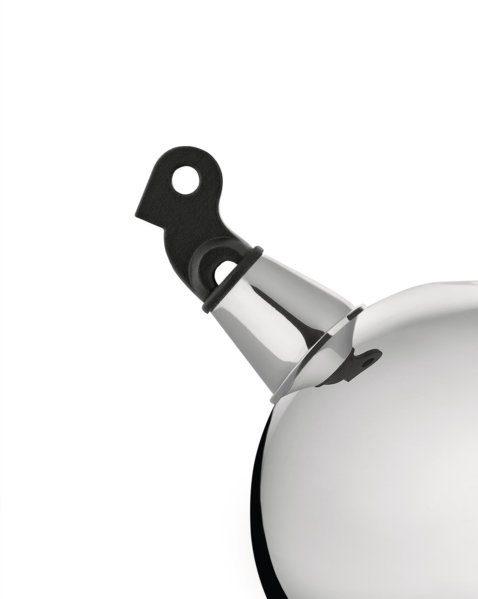 Polished stainless steel whistling kettle by Alessi, with a black bird-shaped whistle on the spout, cropped view.