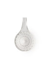 Clear glass citrus squeezer by Alessi, with a wide handle, central starburst pattern, and radial channels, viewed from above.