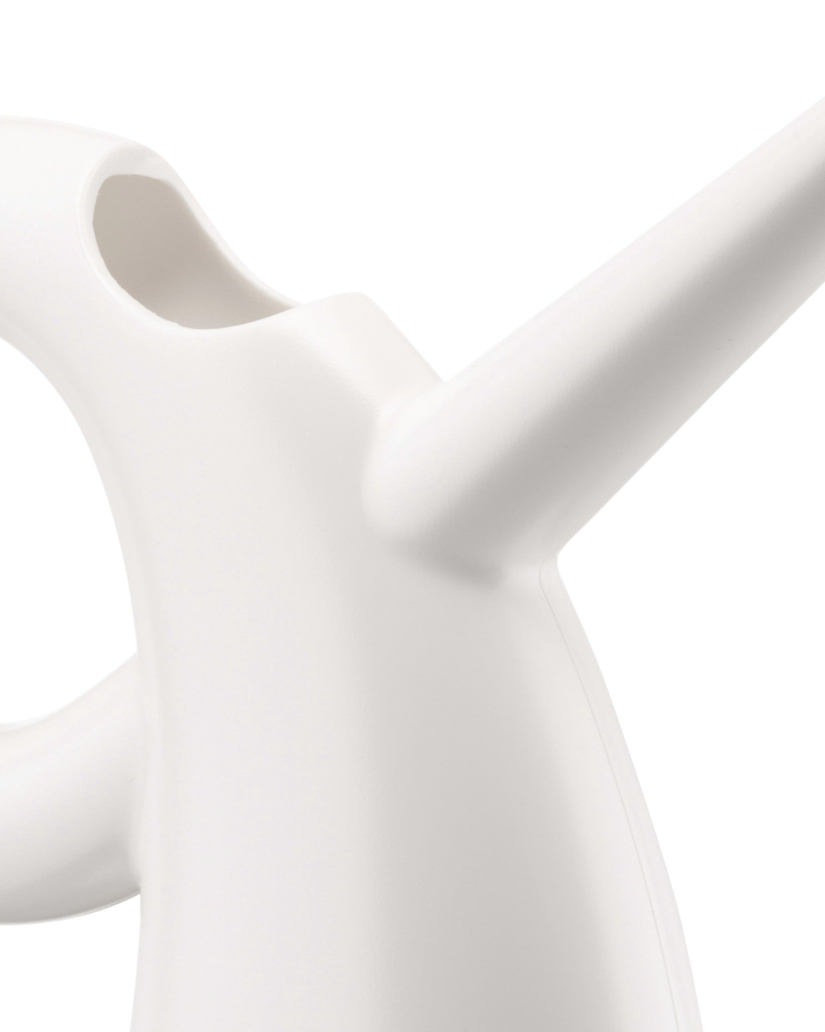 Close-up of a white watering can by Alessi, Diva model, with a sleek, modern design.
