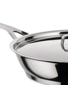Stainless steel frying pan with lid by Alessi, in a close-up, angled view highlighting its shiny, reflective finish and handle.