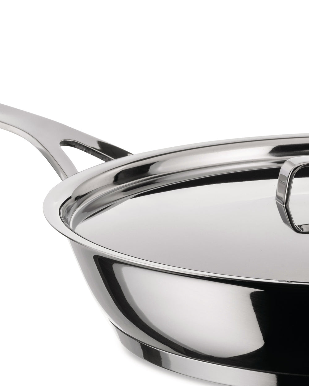 Stainless steel frying pan with lid by Alessi, in a close-up, angled view highlighting its shiny, reflective finish and handle.