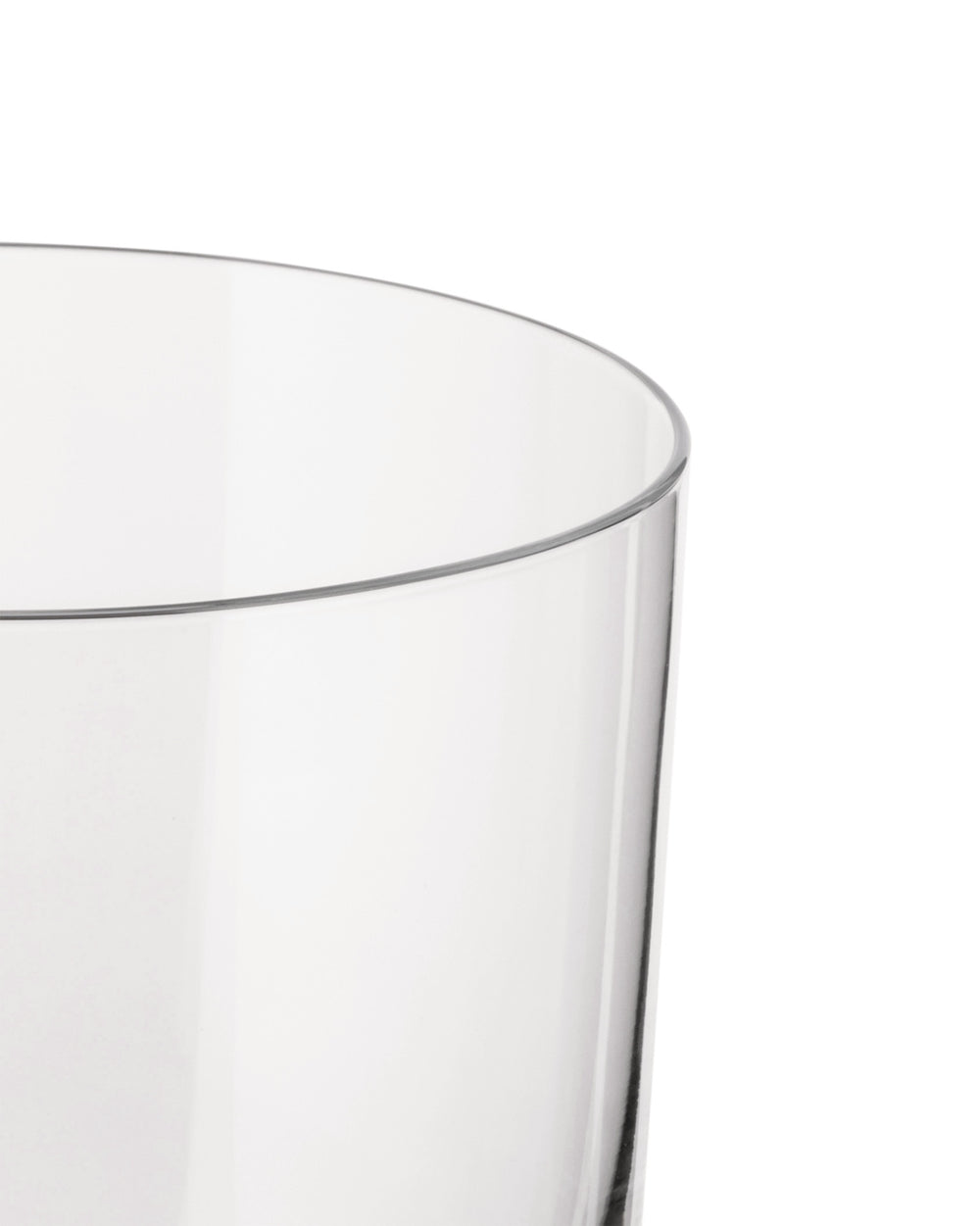 A clear glass by Alessi, with a smooth, simple cylindrical form, shown in a cropped close-up.