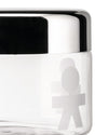 Clear glass storage jar with a chrome lid by Alessi, featuring a frosted boy figure pattern in a close-up side view.