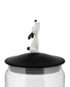 Clear glass LulàJar by Alessi with a black lid and white dog figure looking up.