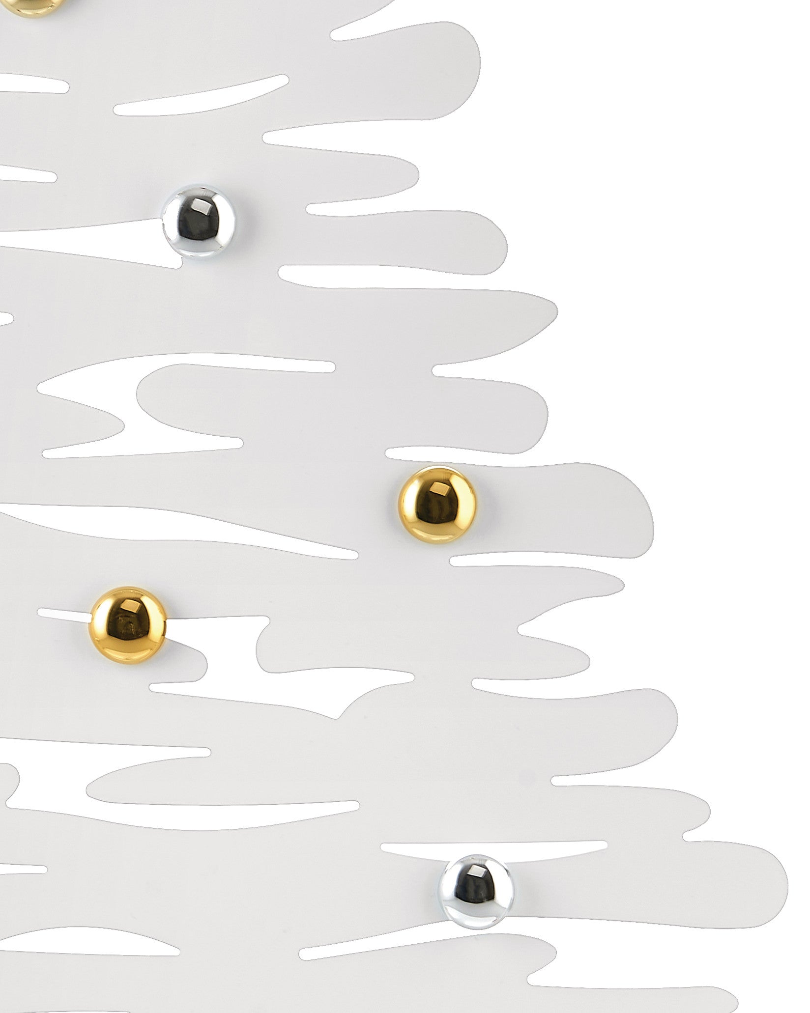 White decorative Christmas tree by Alessi, adorned with shiny gold and silver spherical ornaments.