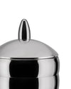 Shiny metal jar by Alessi with a domed lid and pointed finial, cropped close-up.