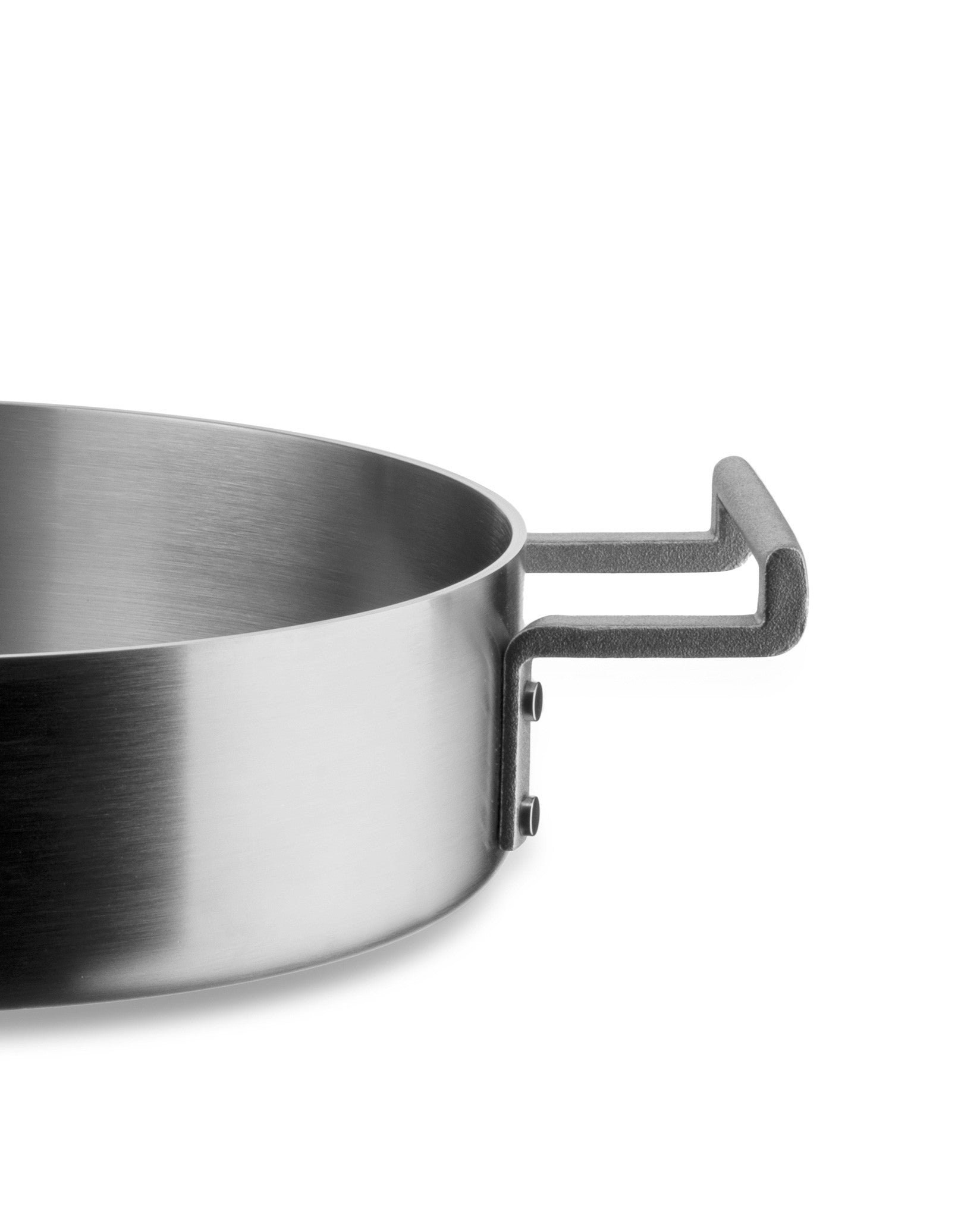 Brushed stainless steel pot by Alessi with two dark grey textured handles, side view.