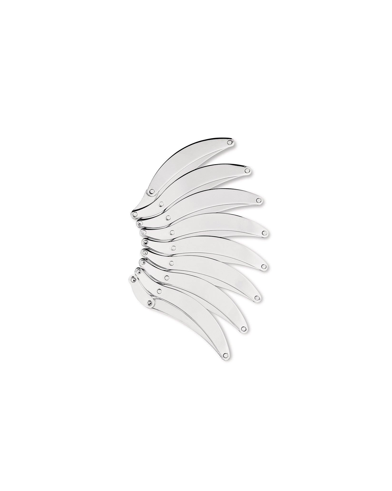 Silver metal trivet by Alessi, featuring multiple interlocking curved segments.