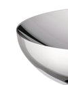 Polished silver double bowl by Alessi, with a curved, highly reflective surface in a close-up view.