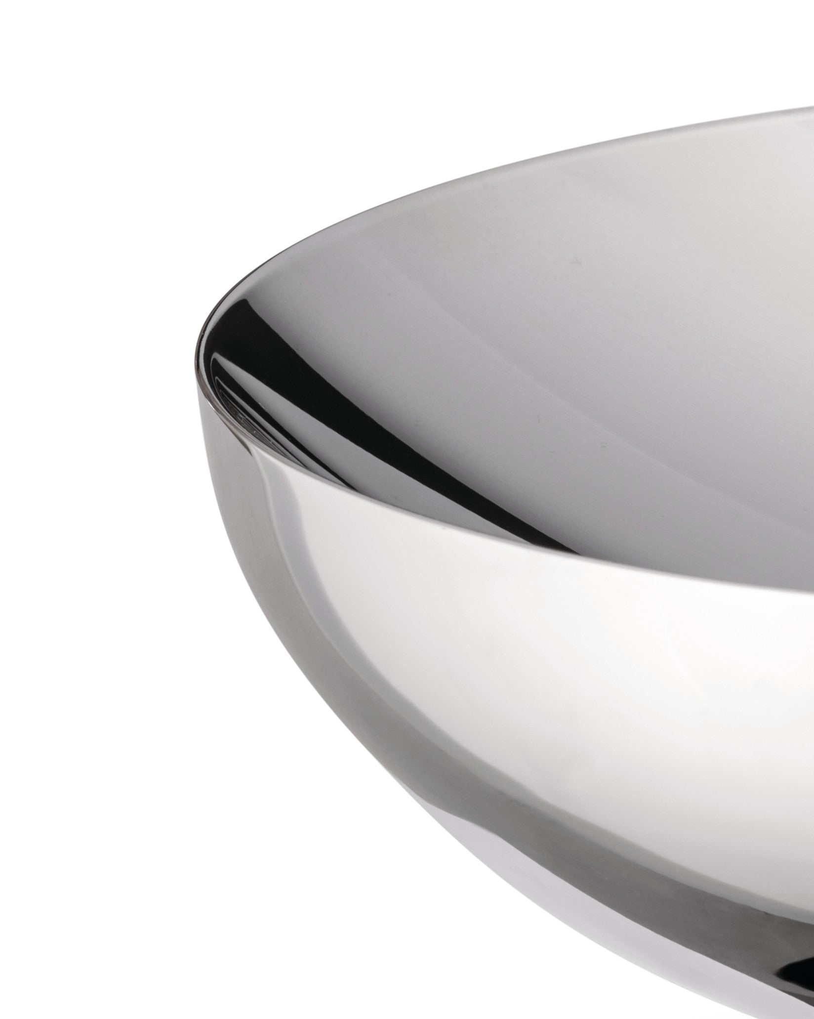 Polished silver double bowl by Alessi, with a curved, highly reflective surface in a close-up view.