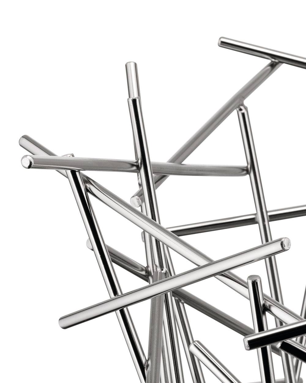 Silver metal fruit bowl by Alessi, featuring an abstract design of intersecting polished rods, close-up view.