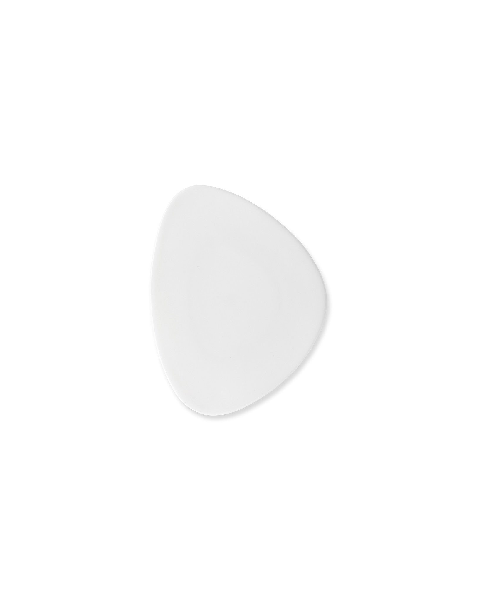 White irregular plate by Alessi with an organic shape and subtle shadow.